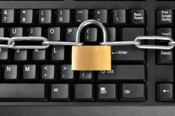 Cybersecurity symbol of a padlock across a keyboard